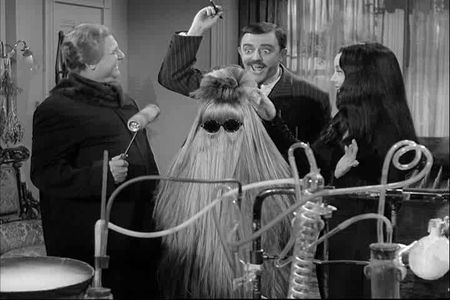 Jackie Coogan, John Astin, Carolyn Jones, and Felix Silla in The Addams Family (1964)