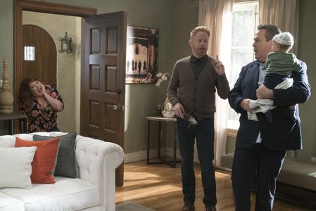 Jesse Tyler Ferguson, Eric Stonestreet, and Dana Powell in Modern Family (2009)