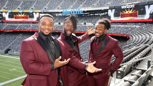 Kofi Kingston, Austin Watson, and Ettore Ewen at an event for WrestleMania 35 (2019)