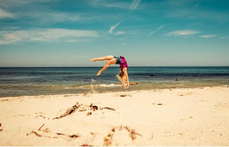 Alice Flipping Down the Beach