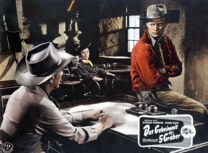 Donna Reed, Richard Widmark, and Robert Foulk in Backlash (1956)