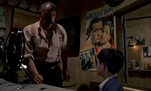 Salvatore Cascio and Philippe Noiret in Cinema Paradiso (1988)