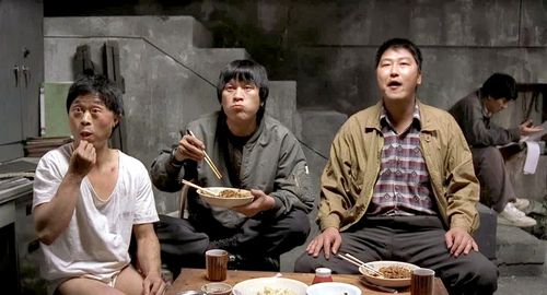 Song Kang-ho, Kim Sang-kyung, and Roe-ha Kim in Memories of Murder (2003)