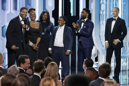 Tom Hanks, Denzel Washington, Pauletta Washington, John David Washington, Olivia Washington, and Katia Washington at an 