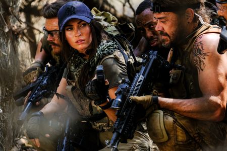 Megan Fox, Brandon Auret, Sisanda Henna, and Greg Kriek in Rogue (2020)