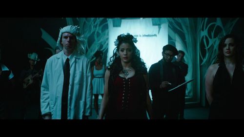 Doris Morgado as Desma Normal and Erik A. Williams as Scientist