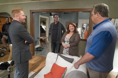 Jesse Tyler Ferguson, Eric Stonestreet, and Dana Powell in Modern Family (2009)