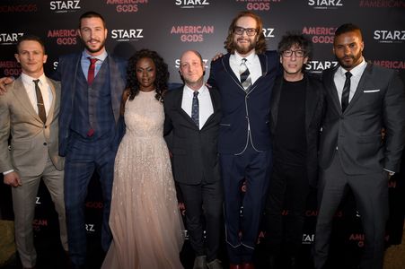 Jonathan Tucker, Bryan Fuller, Neil Gaiman, Michael Green, Pablo Schreiber, Ricky Whittle, and Yetide Badaki at an event