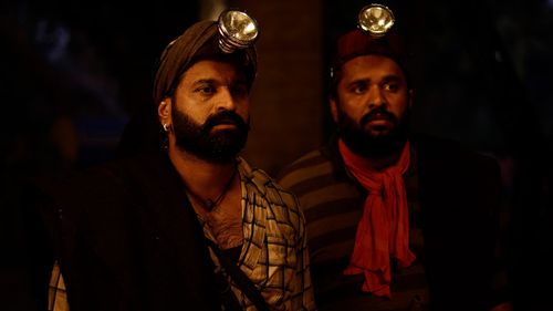 Rishab Shetty and Pramod Shetty in Kantara (2022)