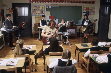 (Center) Jack Black as Dewey, (kids back row, left to right) Robert Tsai as Lawrence, Joey Gaydos Jr. as Zack, Kevin Cla