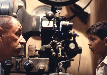 Salvatore Cascio and Philippe Noiret in Cinema Paradiso (1988)