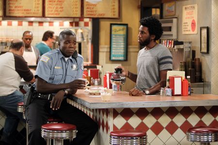 Reno Wilson and Nyambi Nyambi in Mike & Molly: The Honeymoon Is Over (2012)