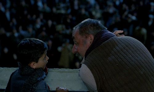 Salvatore Cascio and Philippe Noiret in Cinema Paradiso (1988)