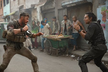 Randeep Hooda, Mishka Tarkar, and Chris Hemsworth in Extraction (2020)