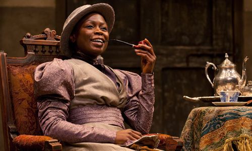 Prudence (Zainab Jah) enjoying a pipe and cup of tea at Chilfords house in the world premiere production of The Convert