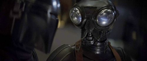 Chris Bartlett as mercenary droid, Q9-0 (Zero) in The Mandalorian, chapter 6: The Prisoner