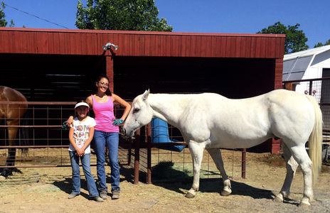 Tsailii Rogers preparing to give her niece a horse riding lesson (June 17, 2014)