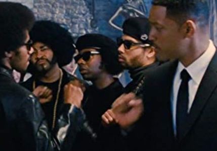 'Men In Black 3' film.Huey Newton (Dennis Jay Funny) and the Black Panthers give Agent J (Will Smith) a pound, at Andy W