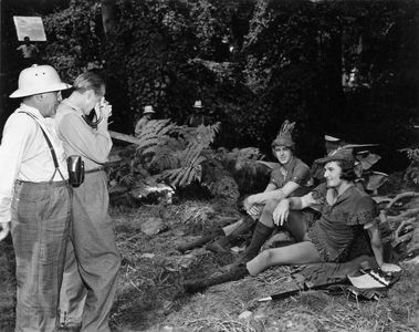 Errol Flynn, Michael Curtiz, and Patric Knowles in The Adventures of Robin Hood (1938)