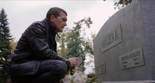 Frank Valera (Antonio Banderas) visits the grave of his daughter Olivia (Lillian Blankenship) and wife Sue (Cristina Ser