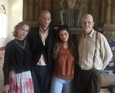 Michael Berryman, Fedor Steer, Julia Kay, and Isadora Cruz in The Mad Hatter (2021)