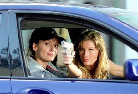 Ana Cristina de Oliveira and Gisele Bündchen in Taxi (2004)