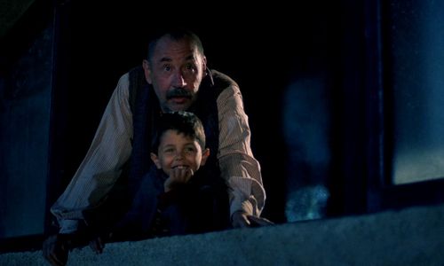 Salvatore Cascio and Philippe Noiret in Cinema Paradiso (1988)