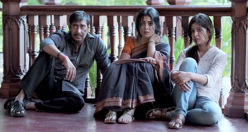 Ajay Devgn, Shriya Saran, and Ishita Dutta in Drishyam (2015)