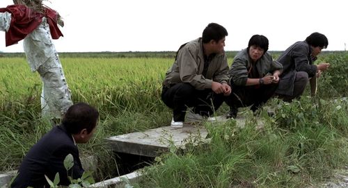 Song Kang-ho, Kim Sang-kyung, and Roe-ha Kim in Memories of Murder (2003)