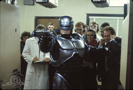 Peter Weller, Miguel Ferrer, Stephen Berrier, Sage Parker, Felton Perry, Karen Radcliffe, and Yolonda Williams in RoboCo