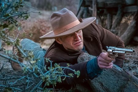 Yakov Kolontarov using his weapon on the set of Wild West Chronicles for his character