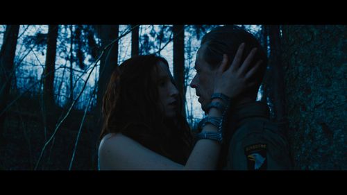 Anna Paliga (as Stria) and Fredrik Wagner (as Rucker) in Warhunt