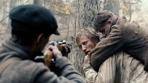 Vladislav Abashin, Vladimir Svirskiy, and Sergey Kolesov in In the Fog (2012)