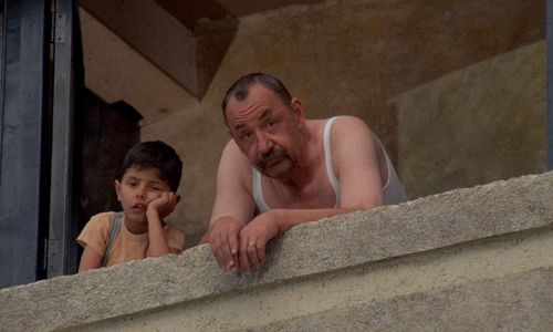 Salvatore Cascio and Philippe Noiret in Cinema Paradiso (1988)