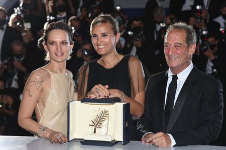 Vincent Lindon, Julia Ducournau, and Agathe Rousselle at an event for Titane (2021)