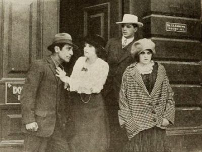 Charlotte Burton, Edward Coxen, George Field, and Winifred Greenwood in The Redemption of a Pal (1914)