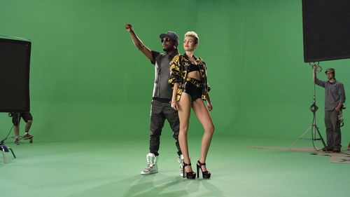 Miley Cyrus and Will.i.am in Will.I.Am Feat. Miley Cyrus, Wiz Khalifa, French Montana: Feelin' Myself (2013)