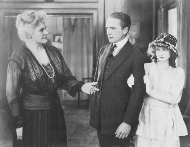 Tom Forman, Elinor Hancock, and Vivian Martin in A Kiss for Susie (1917)