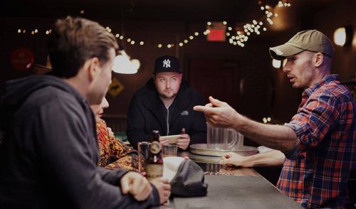 Director Matt Watterworth watches over Brady Roberts and Kevin Doree on the set of 