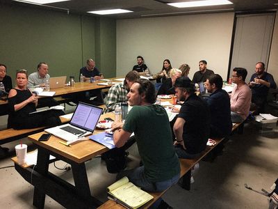 Producer Mark Heidelberger (center) in a production meeting for feature film 