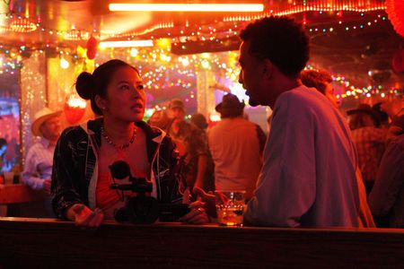 Travis Bennett and Christine Ko in Dave: Texas (2023)