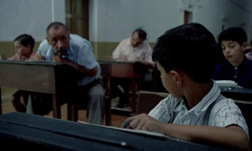 Salvatore Cascio, Tano Cimarosa, and Philippe Noiret in Cinema Paradiso (1988)