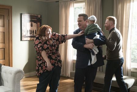 Jesse Tyler Ferguson, Eric Stonestreet, and Dana Powell in Modern Family (2009)