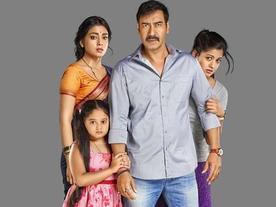 Ajay Devgn, Shriya Saran, Ishita Dutta, and Mrunal Jadhav in Drishyam (2015)