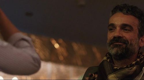 Rosamund Pike and Pano Masti in A Private War (2018)