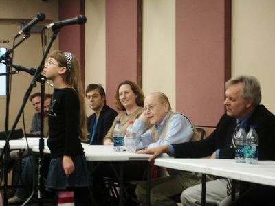 Walter Bobbie & production team watch Melody sing her song with the Broadway orchestra.