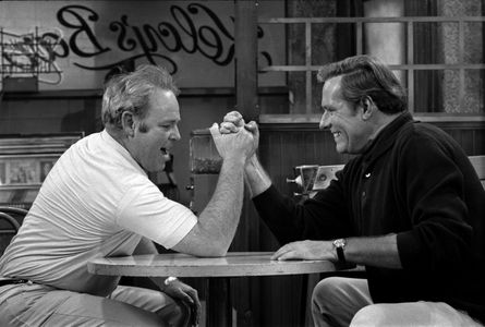 All In The Family episode: 'Judging Books by Covers', featuring (from left) Carroll O'Connor as Archie Bunker arm wrestl