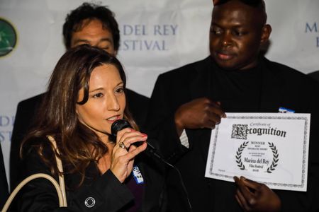 Christina Jo'Leigh accepting the best drama award for '30 Days to Say Goodbye' at the Marina del Rey Film Festival.