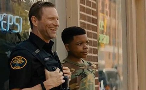 Elijah M. Cooper with Aaron Eckhart in London of Duty