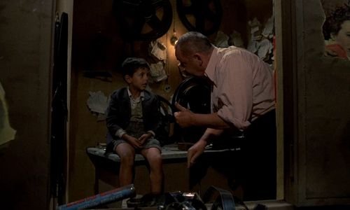 Salvatore Cascio and Philippe Noiret in Cinema Paradiso (1988)